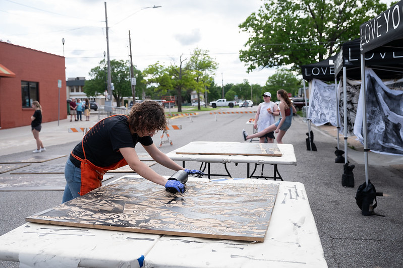 me rolling ink on to a fellow students wood block